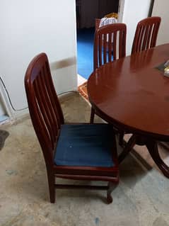 wooden Dining Table with 4 chairs and chair cushions