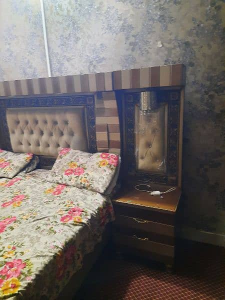 Bed with a side table and dressing table 1