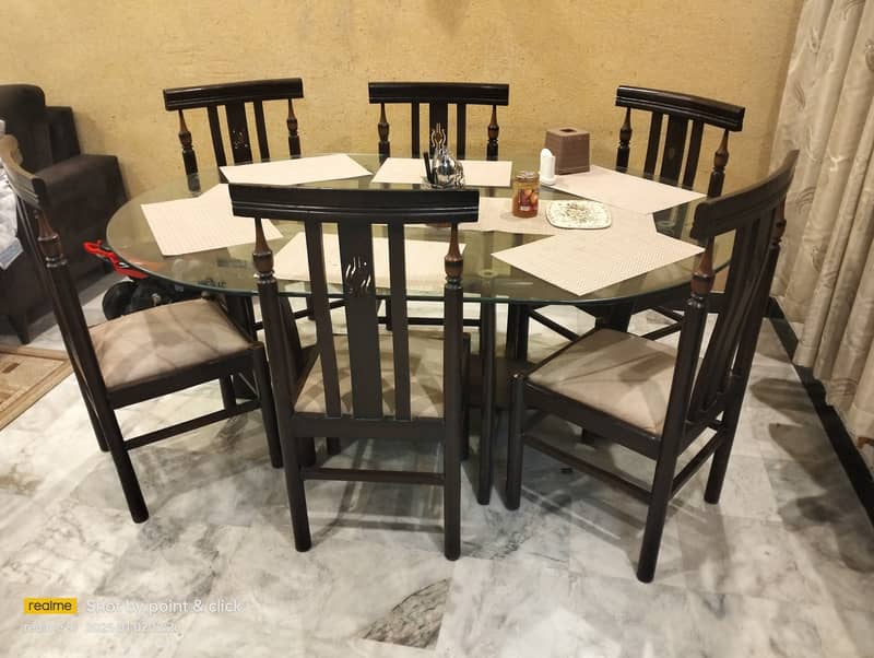 6 seater glass mounted dinning table with chairs up for sale. 0