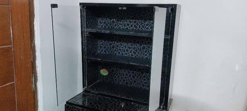 3 drawers and one mirror box same color black almost new condition 4