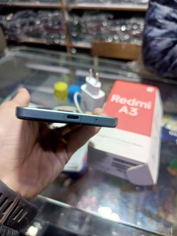 redmi a3 with box charger good condition 2