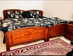 2 single bed with mattress and 1 side table