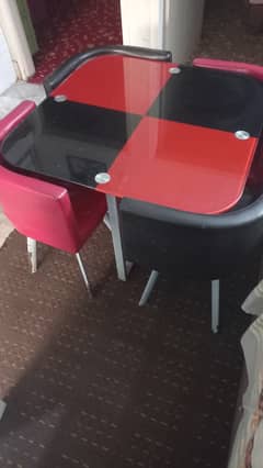 Glass Top with 4 chairs (2 red & 2 black)