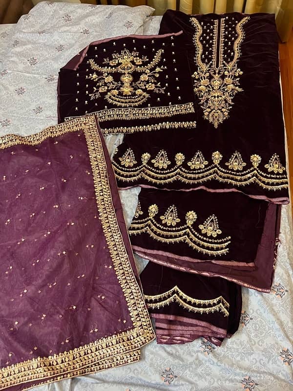 fancy soft velvet embroidered complete suit is available for selling. 0