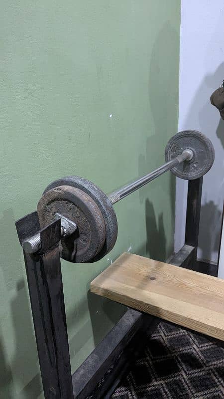 Bench press and Barbell bar with weights 0