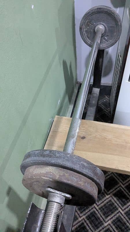 Bench press and Barbell bar with weights 3