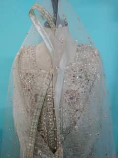 off white net gown dress,suit,stone work on net gown is available