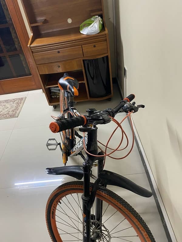 Orange bicycle for sale 3