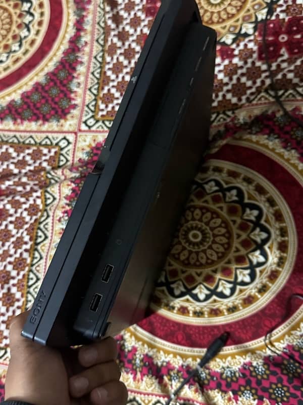 PlayStation 3 slim with 2 wireless controllers and 9cds all working 4