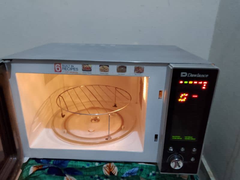 Dawlance 2 in 1 grill + microwave oven with stand 2 days warranty 1