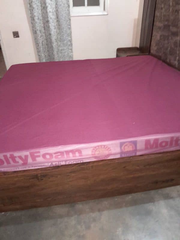 King Size wooden bed with 2 side tables and a sofa seat 0