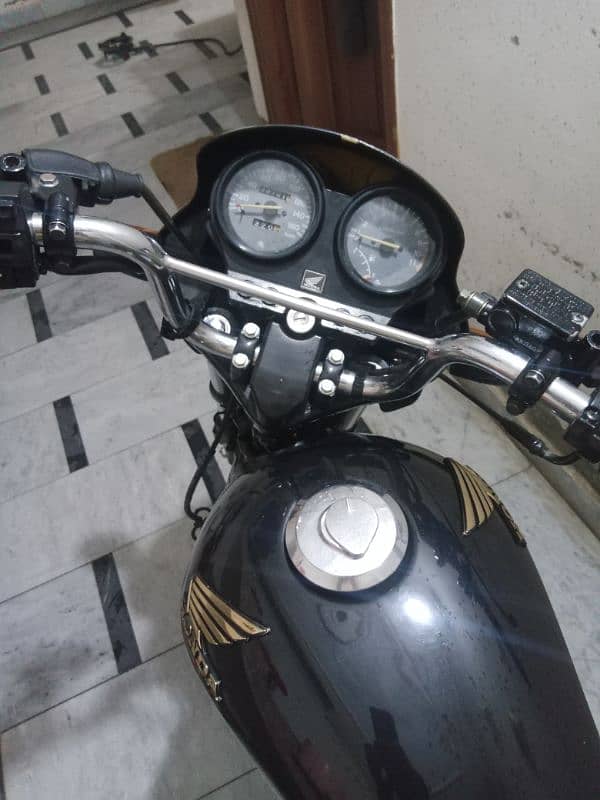 Honda deluxe mobile number 032157 27956 13