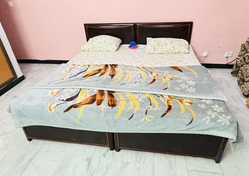 Two wooden Single Beds with mattress 0