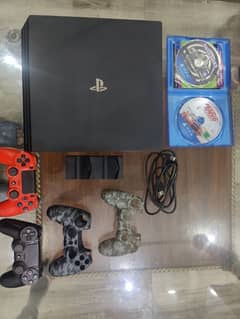 Ps4 pro 1Tb jailbreak 10/10 condition with 10 games and 2 original cd