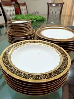 Dinner Set with black and gold intricate pattern.