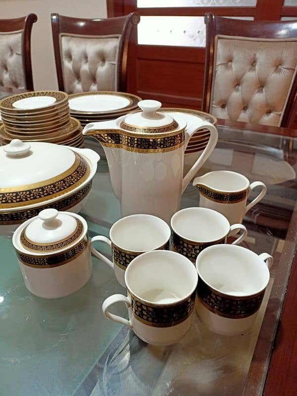 Dinner Set with black and gold intricate pattern. 4