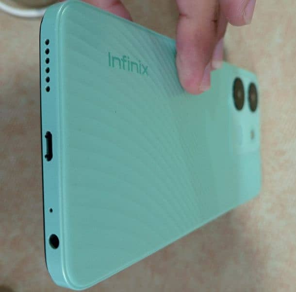 Infinix smart 7 with box and charger and free back cover unique color. 5