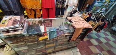 garment business for sale with counter & stands