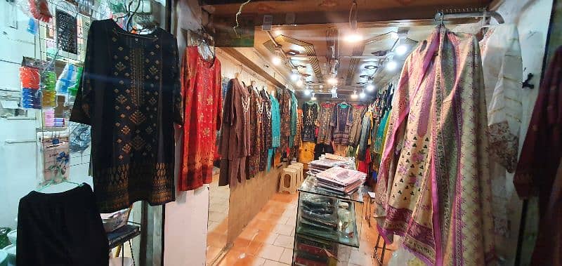 garment business for sale with counter & stands 1