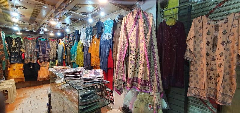 garment business for sale with counter & stands 3