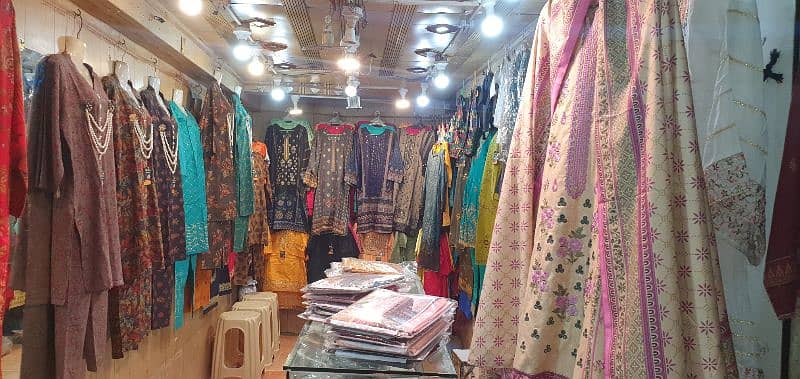 garment business for sale with counter & stands 6