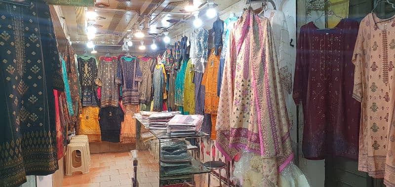 garment business for sale with counter & stands 10