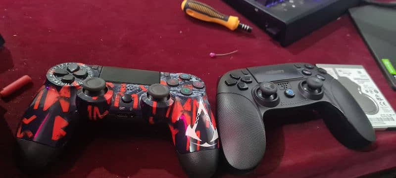 2 ps4 controller 1 is gomary edition other is assasins creed ed 0