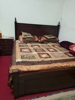 king size bed with dressing table and side tables