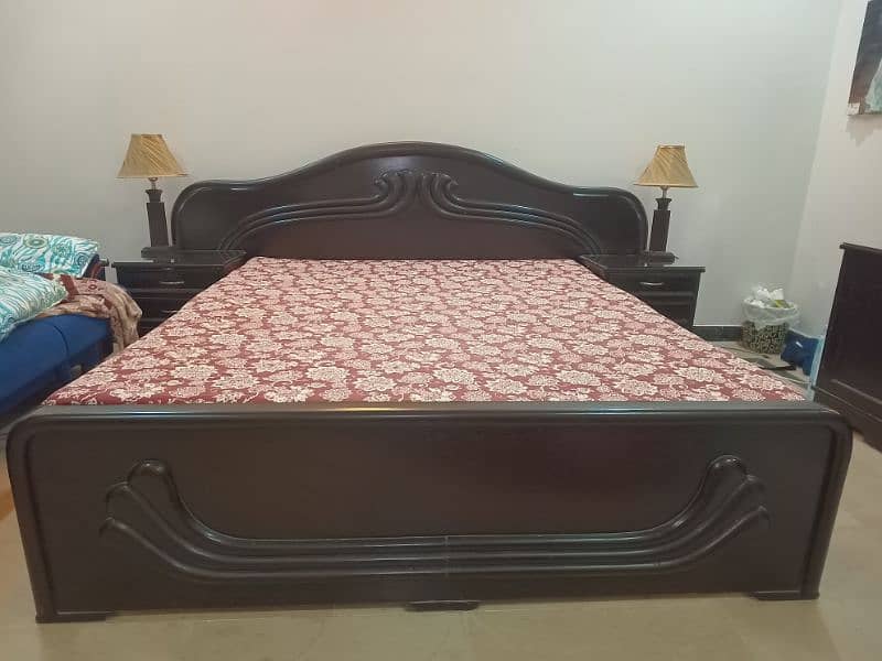 Wooden bed with dresser 0