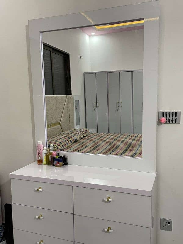 White bed set with side tables and vanity. 3