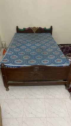 single bed with matress and side table