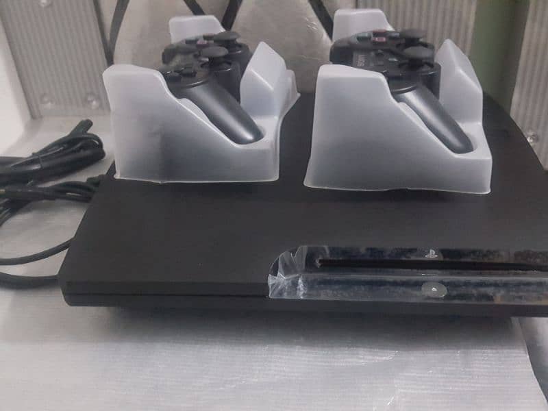 ps3 500gb 50 games installed with 2 remotes wirelles 2