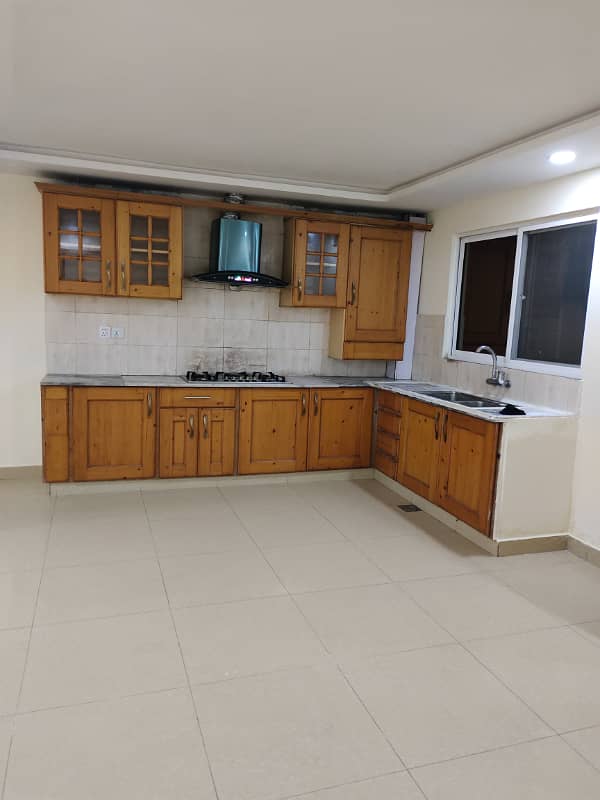 Beautiful luxury apartment available for sale in F-11 Islamabad at maine road, 3 bedrooms with bathrooms, drawing, dining, a Big TVL, servant quarter with bathroom and separate car porch, on reasonable price, 3