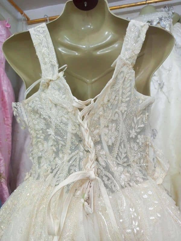 Elegant Lace Wedding Dress with Beaded Details 3