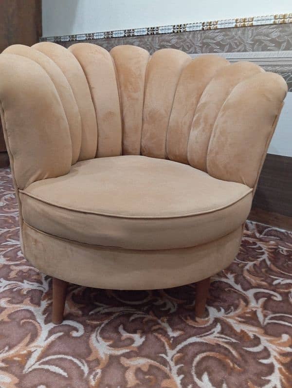 Two seater crowned shape brown colour sofa with free center table 0