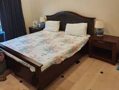 King size bed with tables and chairs