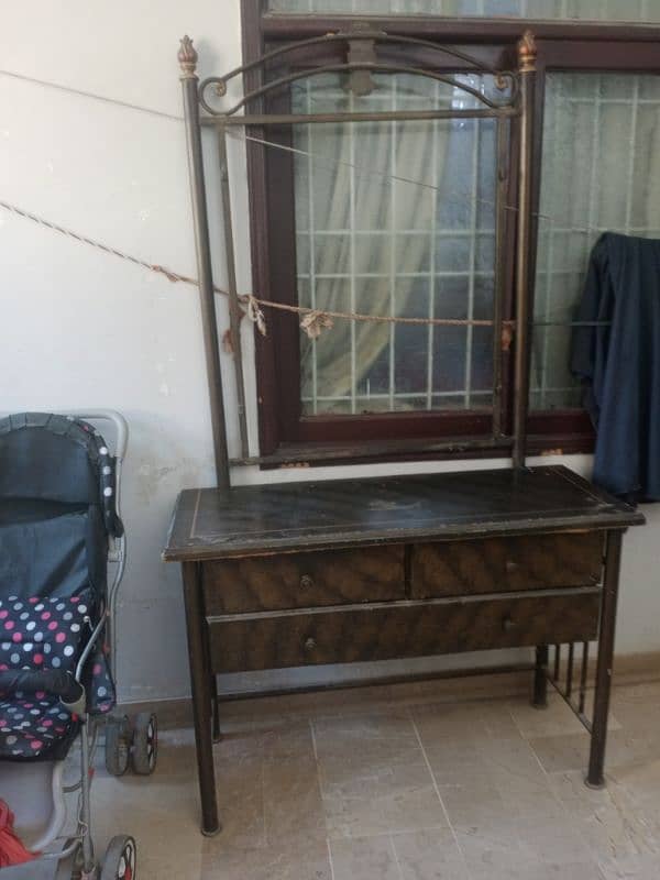 Iron and wooden dressing table . mirror is also available . 0