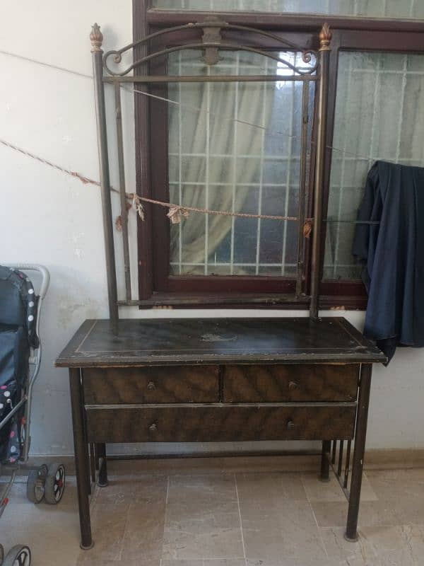 Iron and wooden dressing table . mirror is also available . 1