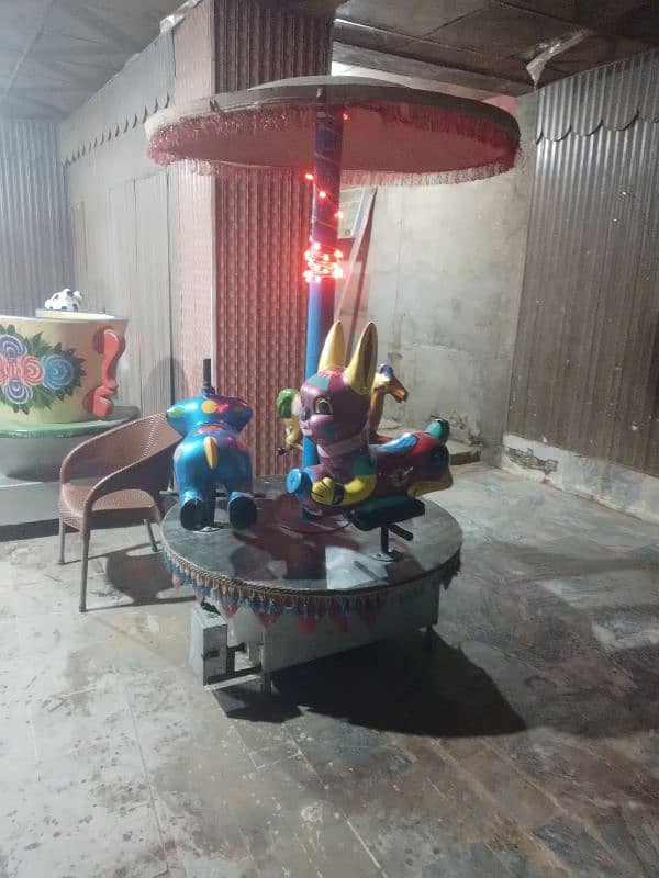 Kids token rides swings joyland funland electric ride 1