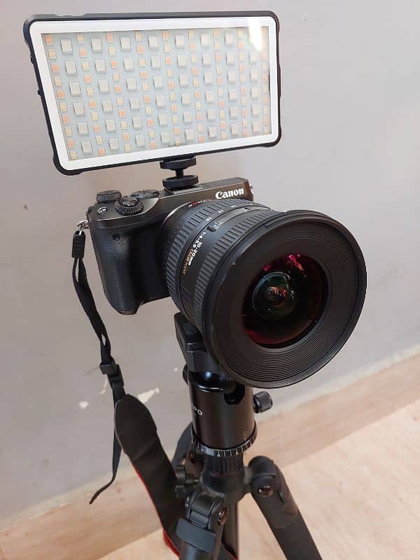 Canon mirrorless m6 with lens, stand, rgb light, mic and lens mount 1