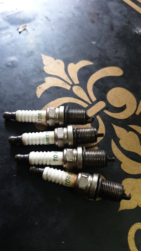 Radium Plugs 16 Number for Baleno Liana Lancer and corolla etc 0