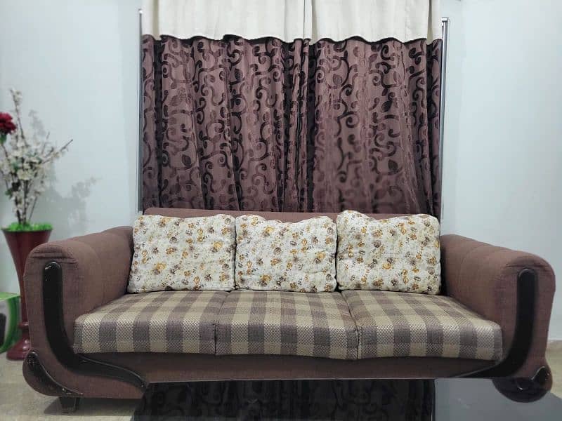 Spacious 7-seater sofa along with glass top center table. 4