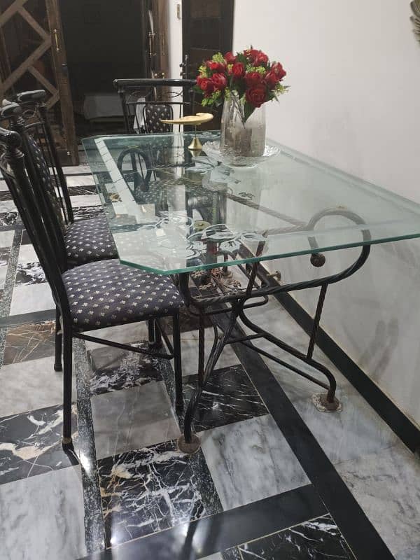 Glass top dining table with 4 chairs 1