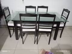 Glass top +bormateak Wood base Dining Table along with 6 wooden Chairs