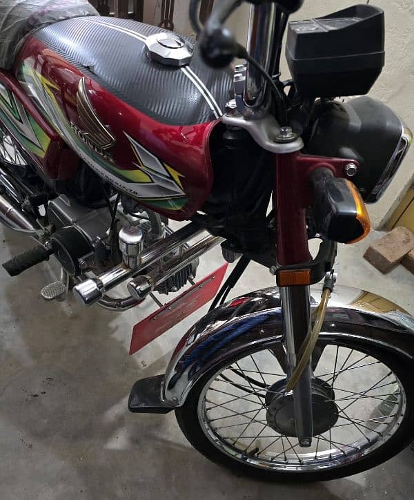 Honda CD 70 Red color very low used like new. 4