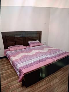 Two Single wooden Beds