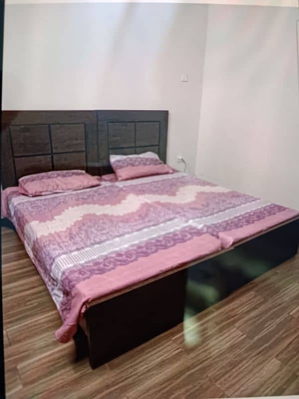 Two Single wooden Beds 1