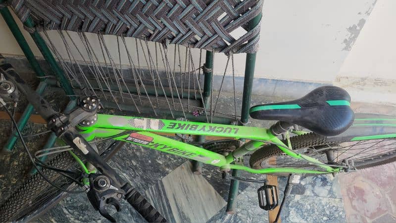 Green Lucky Bike a mountain bicycle with gears 3