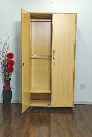 Spacious Wooden Wardrobe with Multiple Shelves and Lockable Drawer – E 1