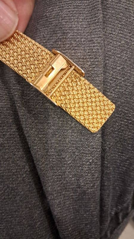 rado movado nivada golden watch with stones 5